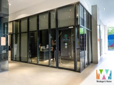 a large glass building with people inside of it at KLCC View Expressionz Family Loft by WGS in Kuala Lumpur