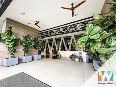 a lobby with potted plants and a bridge at KLCC View Expressionz Family Loft by WGS in Kuala Lumpur