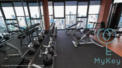 a gym with lots of cardio equipment in a building at Ceylonz Suites by MyKey in Kuala Lumpur