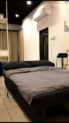 a bedroom with a large bed in a room at 7 mins KLCC next to Hospital Gleneagle in Kuala Lumpur