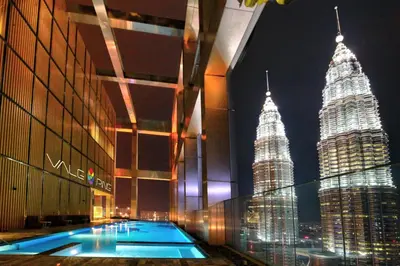 a view of the petronas twin towers at night at Tropicana The Residences KLCC by Vale Pine in Kuala Lumpur