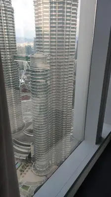 a view of a tall building from a window at Tropicana The Residences KLCC by Vale Pine in Kuala Lumpur