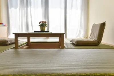 a living room with a table and a chair at Kisetsu no ie, KLCC Kuala Lumpur in Kuala Lumpur