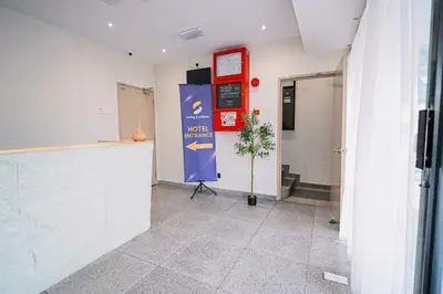 a corridor of a building with a sign on the wall at Swing & Pillows - KL Pekeliling in Kuala Lumpur