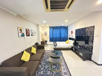 a living room with a couch and a table at Taragon Apartment - KL ,Malaysia in Kuala Lumpur