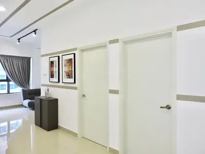 a hallway with sliding doors in a house at Arte Plus By Sleepy Bear in Batu Empat