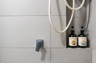 two bottles of wine hanging on a wall at Eko Cheras By Sleepy Bear in Kuala Lumpur