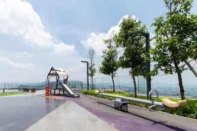a playground with a slide and a swing at Eko Cheras By Sleepy Bear in Kuala Lumpur