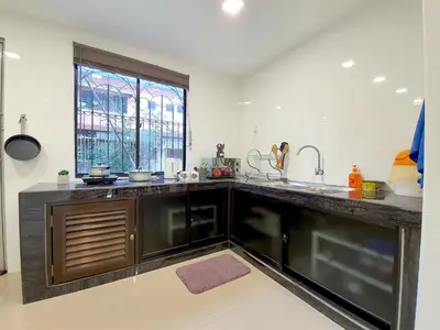 a kitchen with a counter and a sink and a window at Kuala Lumpur Jalan Ipoh Terrace House in Kuala Lumpur