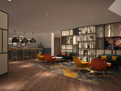 a lobby with colorful chairs and a living room at ACES Hotel Kuala Lumpur in Kuala Lumpur