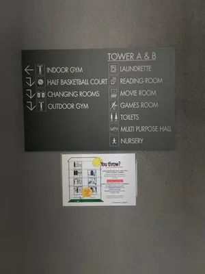 a sign on the wall of a room with a menu at 2 bedroom apartment at 28 Boulavard in Kuala Lumpur