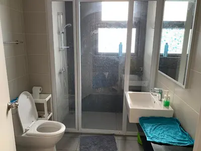 a bathroom with a shower and a toilet and a sink at 2 bedroom apartment at 28 Boulavard in Kuala Lumpur