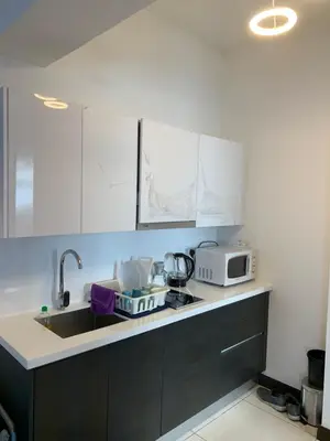 a kitchen with a sink and a microwave at 2 bedroom apartment at 28 Boulavard in Kuala Lumpur