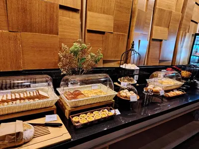 a buffet line with many different types of pastries at Cormar Suites Kuala Lumpur in Kuala Lumpur