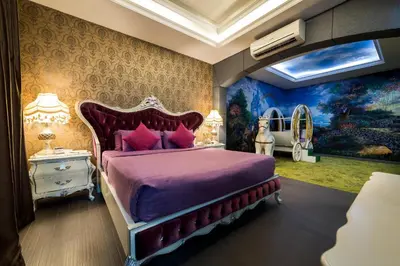 a bedroom with a bed in a room with a painting at Kingston Hotel 3 - Kuala Lumpur in Kuala Lumpur
