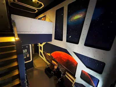 a room with a painting on the side of a spaceship at Kingston Hotel 3 - Kuala Lumpur in Kuala Lumpur