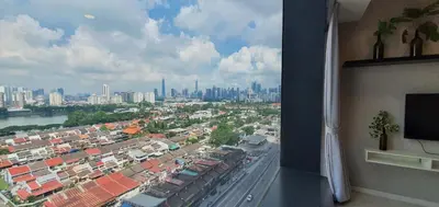 a room with a view of a city from a window at Infinity KLCC Pool at M City Ampang in Kuala Lumpur