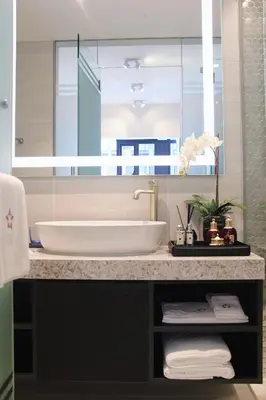 a bathroom with a sink and a large mirror at Star Suites KLCC in Kuala Lumpur
