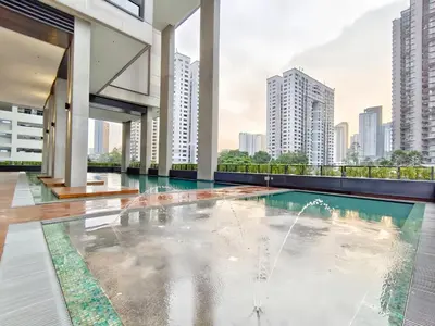 a swimming pool in a building with a city skyline at Arcoris Mont Kiara in Kuala Lumpur