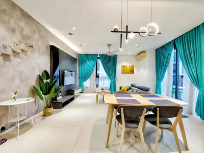 a dining room with blue curtains and a dining table at Arcoris Mont Kiara in Kuala Lumpur