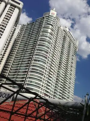 a large white building with a sign on it at Regalia Suites Infinity Pool Kuala Lumpur in Kuala Lumpur