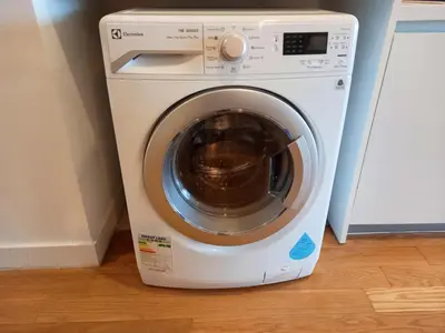a white washer and dryer in a room at Yemala Suites at Platinum KLCC in Kuala Lumpur