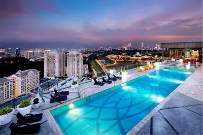 a large swimming pool on the roof of a building at Dorsett Residences Kuala Lumpur in Kuala Lumpur