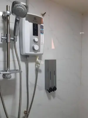 a camera and a hair dryer in a room at Omar's Place 2 in Kuala Lumpur