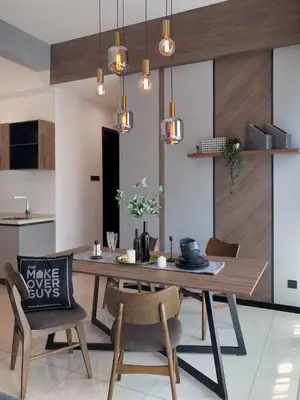 a dining room with a wooden table and chairs at MyCrib Opus Recidence 3 bedroom BBintang in Kuala Lumpur