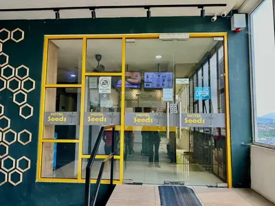 a store front with yellow doors in a building at Seeds Hotel PV128 Setapak in Kuala Lumpur