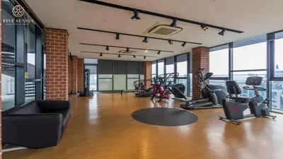 a gym with treadmills and cardio equipment in a building at Ceylonz Suites Kuala Lumpur, Roam in Kuala Lumpur