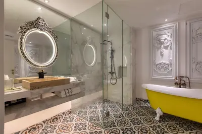a bathroom with a tub and a sink and a mirror at arte by Thomas Chan in Kuala Lumpur