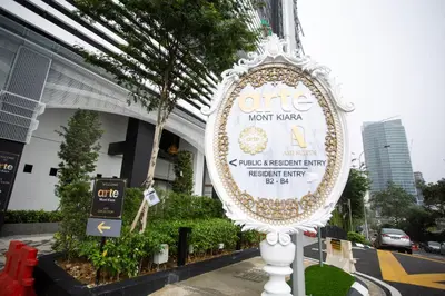 a sign for a hotel in front of a building at ARTE MONT KIARA BY PSM Luxury Suites in Kuala Lumpur