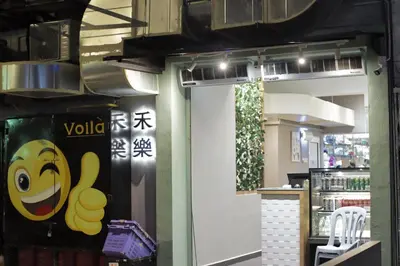 a door to a store with a smiley face on it at Rain Forest Hotel in Kuala Lumpur