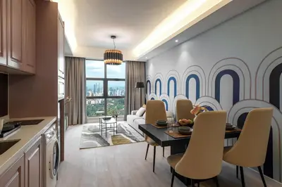 a kitchen and living room with a table and chairs at AMI Suites - Arte Mont Kiara in Kuala Lumpur