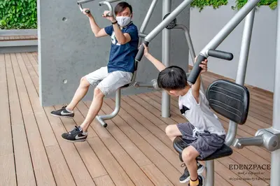 two young boys are playing on a gym at Ceylonz Suites by EdenZpace in Kuala Lumpur