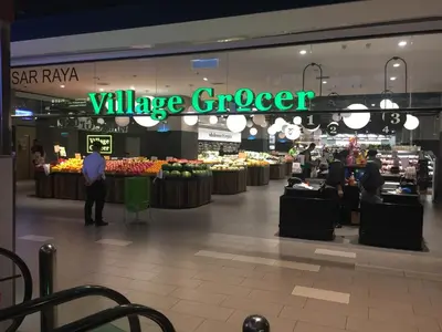 a grocery store with people standing in the aisle at KLGateway Premium Residence Mid Valley in Kuala Lumpur