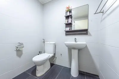 a white bathroom with a toilet and a sink at Fahrenheit88-Japan Theme Bukit Bintang Kuala Lumpur 2R2B 6Pax in Kuala Lumpur