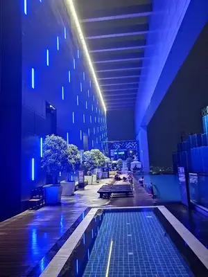 a building with a pool in the middle of a building at Luxe Suites at Platinum KLCC in Kuala Lumpur