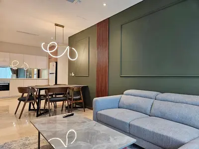 a living room with a couch and a table at Sky Suites KLCC by Asiapex in Kuala Lumpur