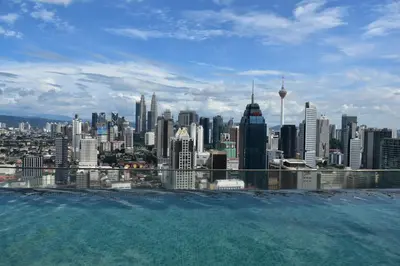 a view of a city skyline from a swimming pool at Wonderful KLCC View at Regalia Suites in Kuala Lumpur