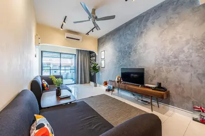 a living room with a couch and a flat screen tv at 3BR Family-Friendly Landed House,PandanPerdana,KL by Verano in Kuala Lumpur