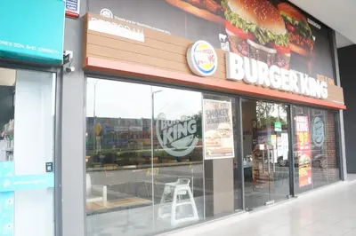 a fast food restaurant with a chair inside of it at M City Lake View 1+1 Room in Kuala Lumpur