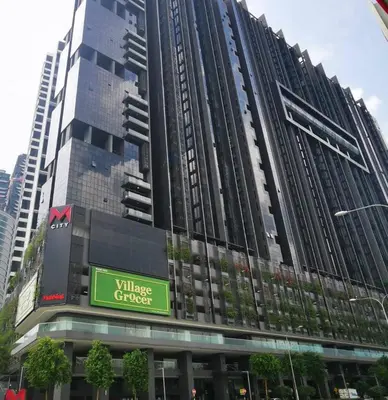a tall building with a sign in front of it at M City Lake View 1+1 Room in Kuala Lumpur