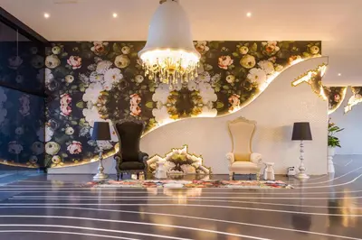 a lobby with two chairs and a chandelier at Arte Mont Kiara in Kuala Lumpur