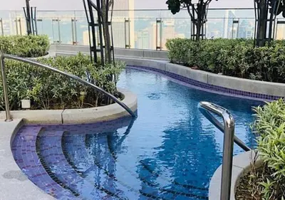 a swimming pool on top of a building at Robertson PanoramaKL Suites in Kuala Lumpur