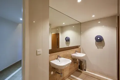 a bathroom with two sinks and a mirror at Vortex KLCC Area in Kuala Lumpur