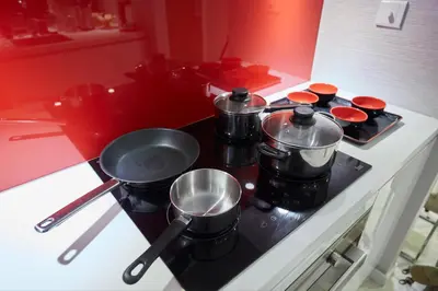 a stove with pots and pans on top of it at Vortex KLCC Area in Kuala Lumpur