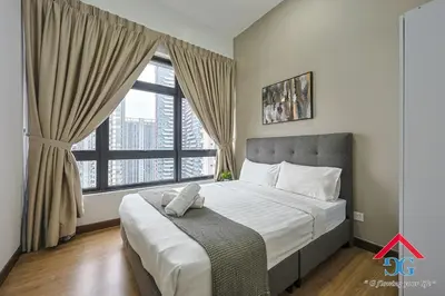 a bedroom with a large bed and a large window at Astoria Ampang By Grabstay in Kuala Lumpur