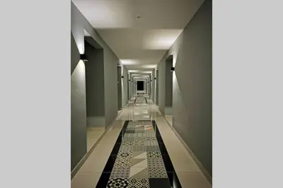 a long hallway with tile flooring and a long corridor at HappyHome @ Arte Mont Kiara Kuala Lumpur Hartamas Damansara in Kuala Lumpur